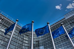 european union flags on poles