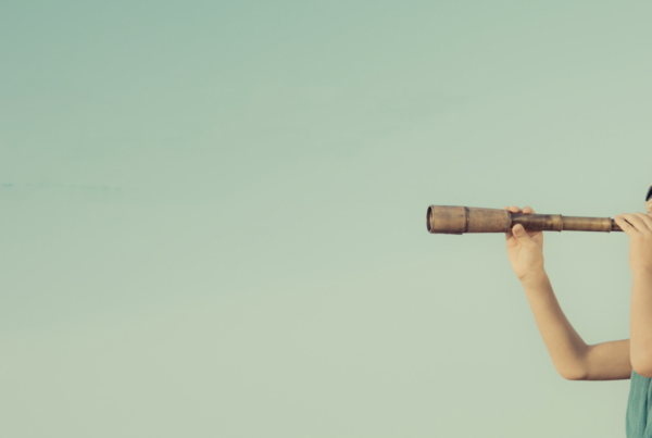 kid looking through telescope